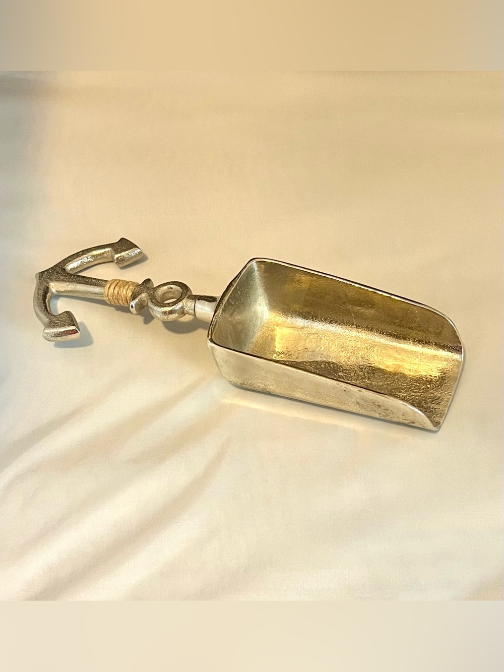 Nautical-themed metal ice scoop w/ a distinct anchor-shaped handle